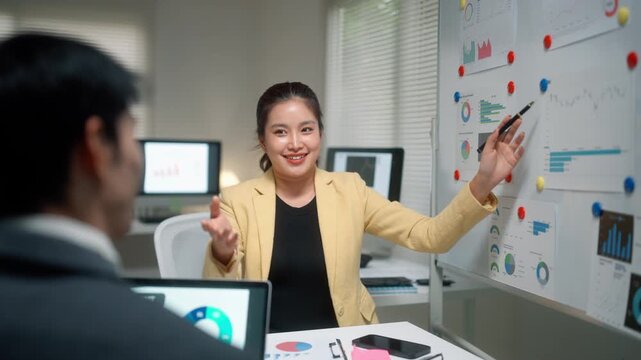Businesswoman Discussing Analytics in Office Meeting