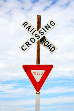 Railroad Rail Road Crossing Sign Signaling Danger and Need to Be Aware of Tracks and Crossing of Road