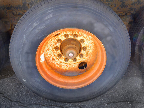 Old Rusty and Worn Work Tire on Industrial Work Truck for Long Hauling and Transportation
