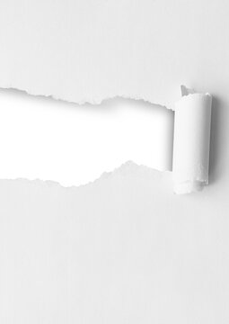 Torn paper sheet with a ripped hole in the middle