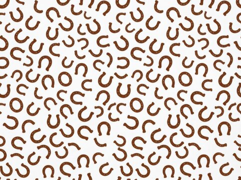 Seamless pattern with brown horseshoes on white background