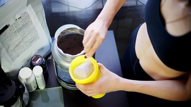 Athlete Scooping Protein Powder Into Shaker Bottle. Sports Nutrition Supplement Preparation 