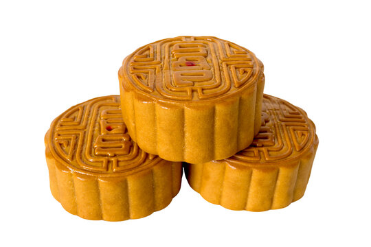 Three mooncakes isolated on white background, tradition Chinese moon cake, sweet dessert for mid autumn celebration. Happy Chinese translation mid autumn festival.