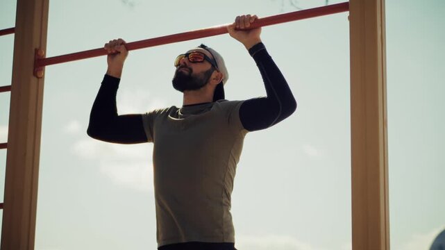 Athlete Doing Pull Ups On Horizontal Bar. Street Workout Training 