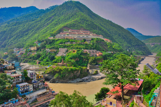 Scenic View of Devprayag River Confluence Surrounded by Himalayan Villages and Green Mountains