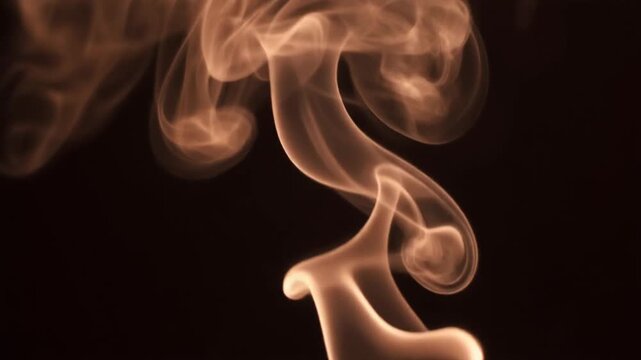 Chestnut-brown smoke coils and drifts upward, tendrils thickening and thinning continuously under warm side lighting against deep black with rich moody atmosphere and cinematic texture.