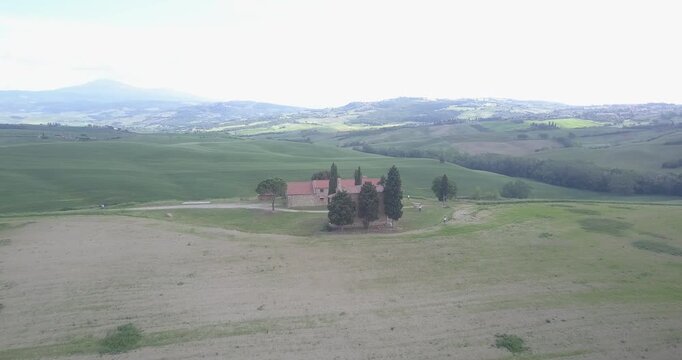 Val d'Orcia, Tuscany, Italy, aerial drone view, winding road with cypresses