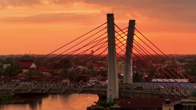A view of Banjarmasin city and the Alalak River Bridge (or Basit Handil Bakti Bridge) in the sunset