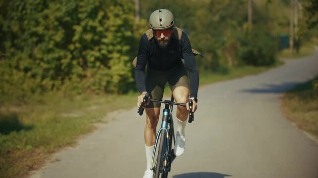 Cyclist Riding Road Bicycle On Rural Asphalt Path. Training Cycling 
