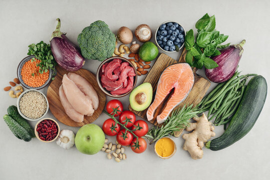 Top view of raw whole foods for Mediterranean diet, clean eating and nutritious meal planning.