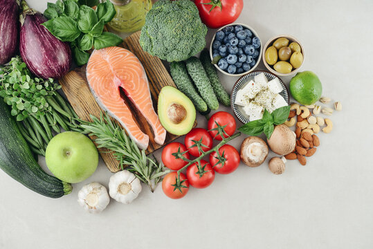 Top view of raw whole foods for Mediterranean diet, clean eating and nutritious meal planning.