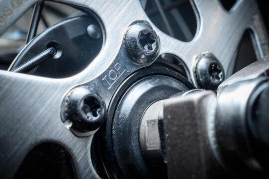 Close-up of shiny steel gears and spokes on a new bicycle with he label &ldquo;TOP&rdquo;
