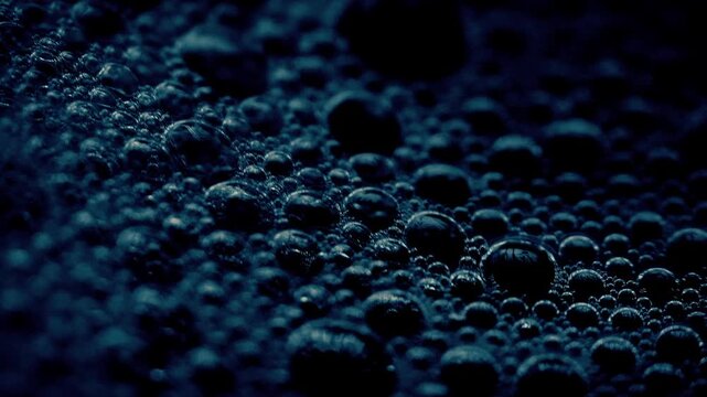 Bubbles On Dark Liquid Close-Up