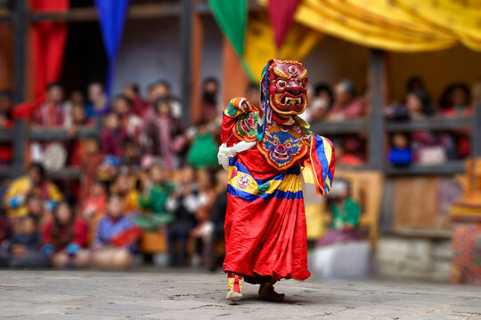 Bumthang in Bhutan at the yearly festival in the monastery of Jakar. A monk is wearing a colourful traditional mask.	