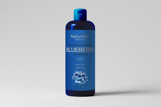 Blue cosmetic bottle mockup with blueberry ingredient graphic for antioxidant shampoo