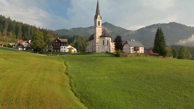 Aerial view of the historic church in the picturesque Gosau village, Austria, Austrian Alps.