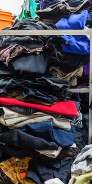 Large pile of tangled old clothes for donation