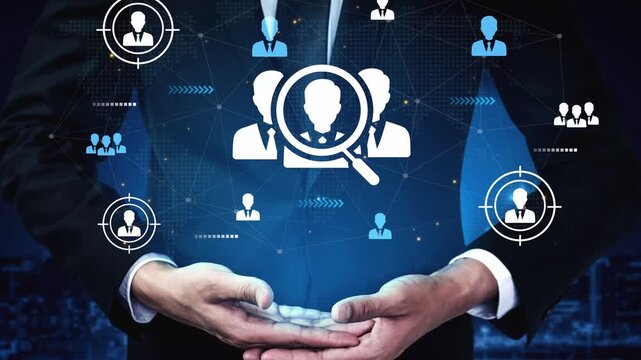 Business professional holds digital interface with icons representing people, targeting, and networking for collaboration and recruitment opportunities in modern workplace. Entropy.