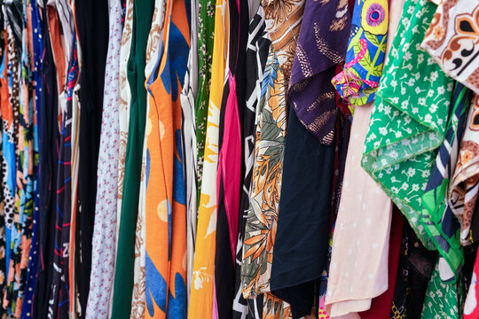 Various dress and t shirt on display at street market, closeup detail