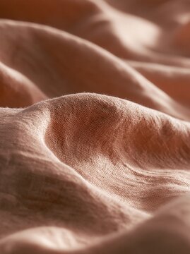 Macro close-up of soft linen fabric with elegant natural folds
