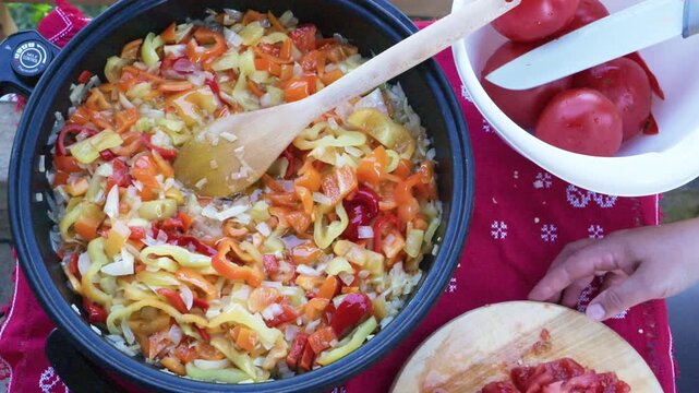 Saut&eacute;ed Vegetables Simmering in Skillet with Wooden Spoon
