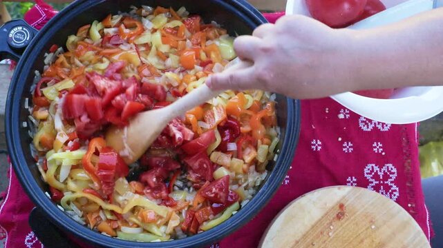 Saut&eacute;ed Vegetables Simmering in Skillet with Wooden Spoon