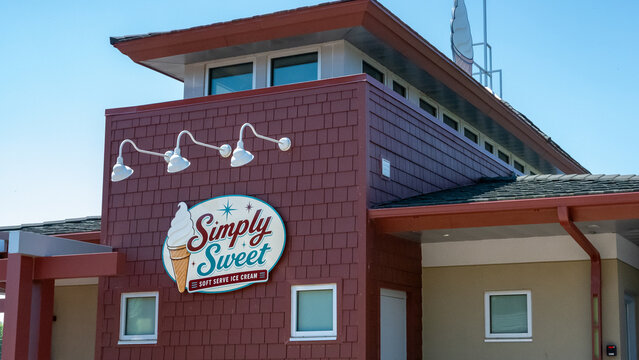 Wausau WI, USA - Jul 12, 2026: Facade of Simply Sweet Ice Cream,  a locally owned downtown business located at Riverlife Park on a sunny day.