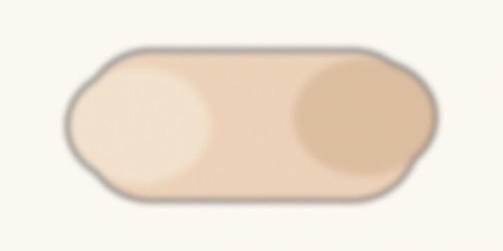 Beige oblong pill isolated on plain background closeup.