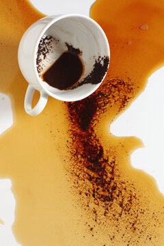 Spilled Coffee Cup on White