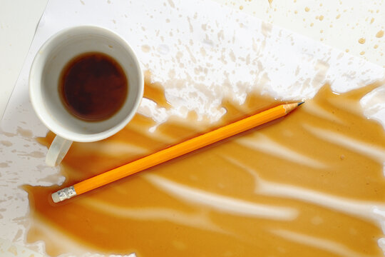 Spilled Coffee Cup and Pencil