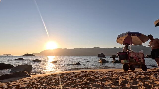 Timelapse Sunset at Juli&atilde;o Beach in Ilhabela, Brazil, with Families, Tourists and Beach Vendors
