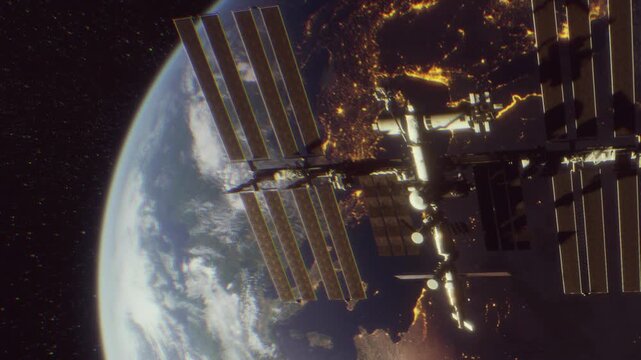 The International Space Station floats in space above Earth during the night. City lights shine below, showing populated areas in Europe. The view captures a mix of darkness and light.