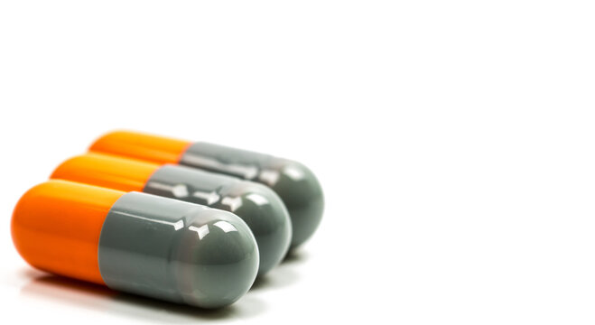 Capsule or pills. Selective focus of antibiotic capsules pills on white background with copy space. Drug resistance concept. Antibiotics drug use with reasonable and global healthcare concept. Minimal