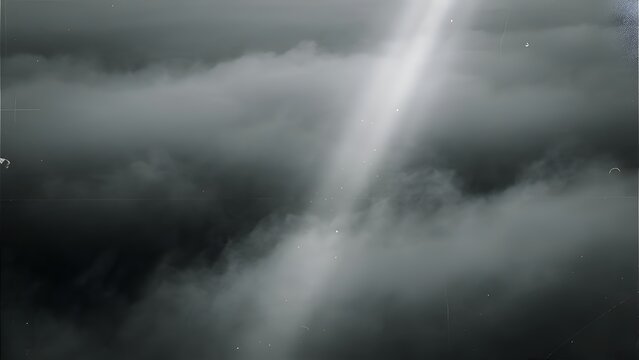 Dramatic cloud formation with a bright light beam pierces through the overcast sky