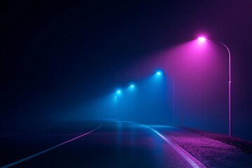 Obraz premium Empty winding road illuminated by neon streetlights on a foggy night