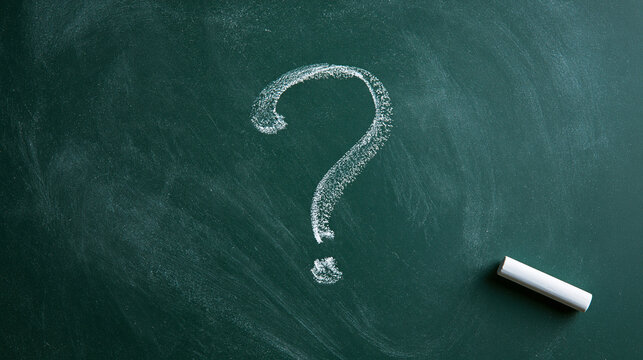 Chalk drawn question mark on green blackboard with piece of white chalk. Conceptual education and problem solving.