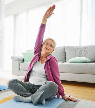 Senior woman exercise stretching yoga at home, health care rehabilitation and recovery and active seniors concept