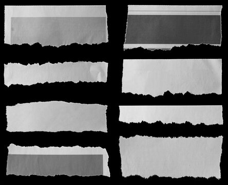 Torn papers on black