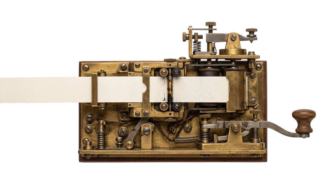Antique brass telegraph machine with paper tape and wooden handle
