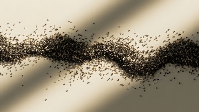 Organic chia seeds arranged in a wavy line pattern against a clean soft beige background