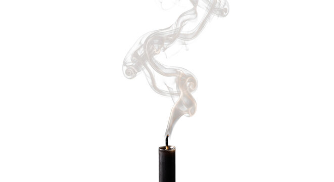 Black candle wick smoking after being extinguished, wisps of smoke rising