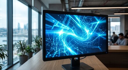 Fototapeta premium A modern computer monitor displays a vibrant blue abstract digital pattern, symbolizing data flow and connectivity, set against a blurred office background with a city view.