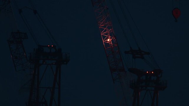 Tokyo,Japan - August 11, 2026: Tower cranes at dawn in Tokyo
