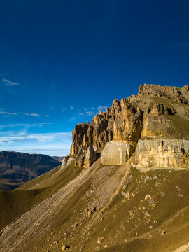 A beautiful view of a mountain plateau with high cliffs. The landscape and nature of the North Caucasus.