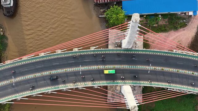 A view of Banjarmasin city and the Alalak River Bridge (or Basit Handil Bakti Bridge) in the late afternoon