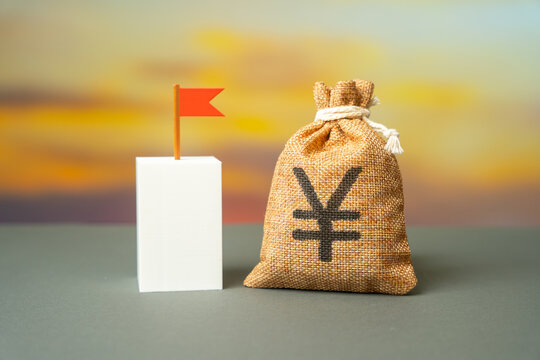 Yen or yuan money bag and flag symbolize the goal to be achieved. Purpose and achievement of a goal. Business target. Personal growth. Success milestone concept, motivation and progress tracking.