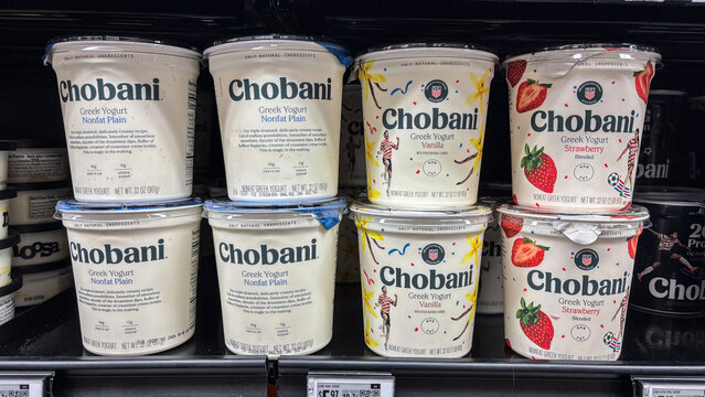 Chobani Yogurt display at a grocery store. Chobani yogurt provides health benefits including high protein content.
