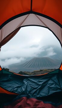 Morning calm inside a tent at Bromo active volcano site, surrounded by misty mountains, site, calm