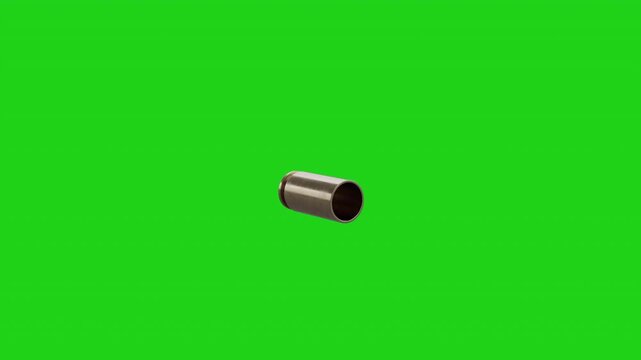 Single metal firearm cartridge casing falling down against a green screen background bullet ammunition brass gun shell