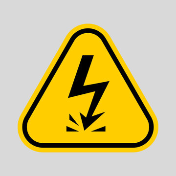 Yellow triangular warning sign with a black lightning bolt striking the ground, symbolizing electrical hazard and danger.